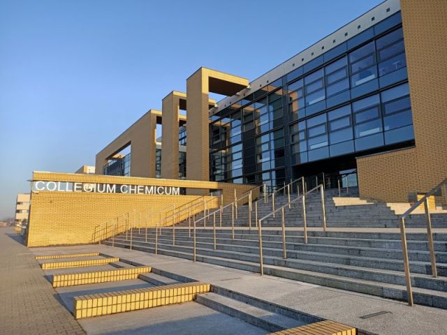 The photograph presents the front entrance of the AMU faculty of chemistry buiding 