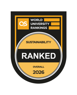 QS World Univeristy Ranking balck black and orange badge. It the yellowish circle it contains information written in black Sustainability overall 2026. In the cirrcle centre there is a black strip with white word RANKED. On the top of the badge, above the yellowish circle, the QS World Univeristy Ranking logo is located. 