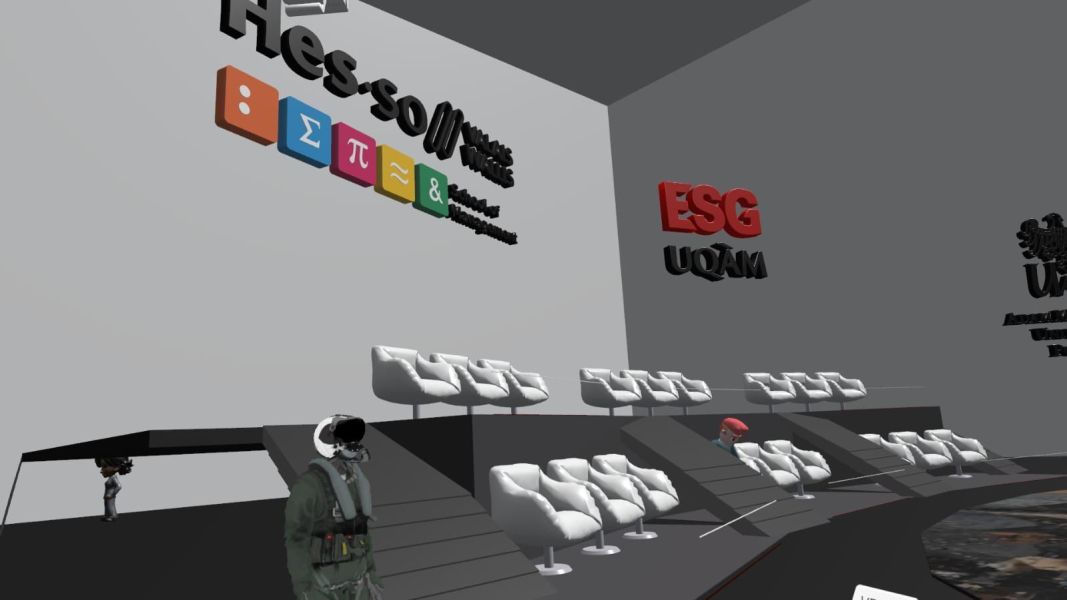 A virtual reality conference room showing the audiance space with a big logo of HEES.SO on the gray wall