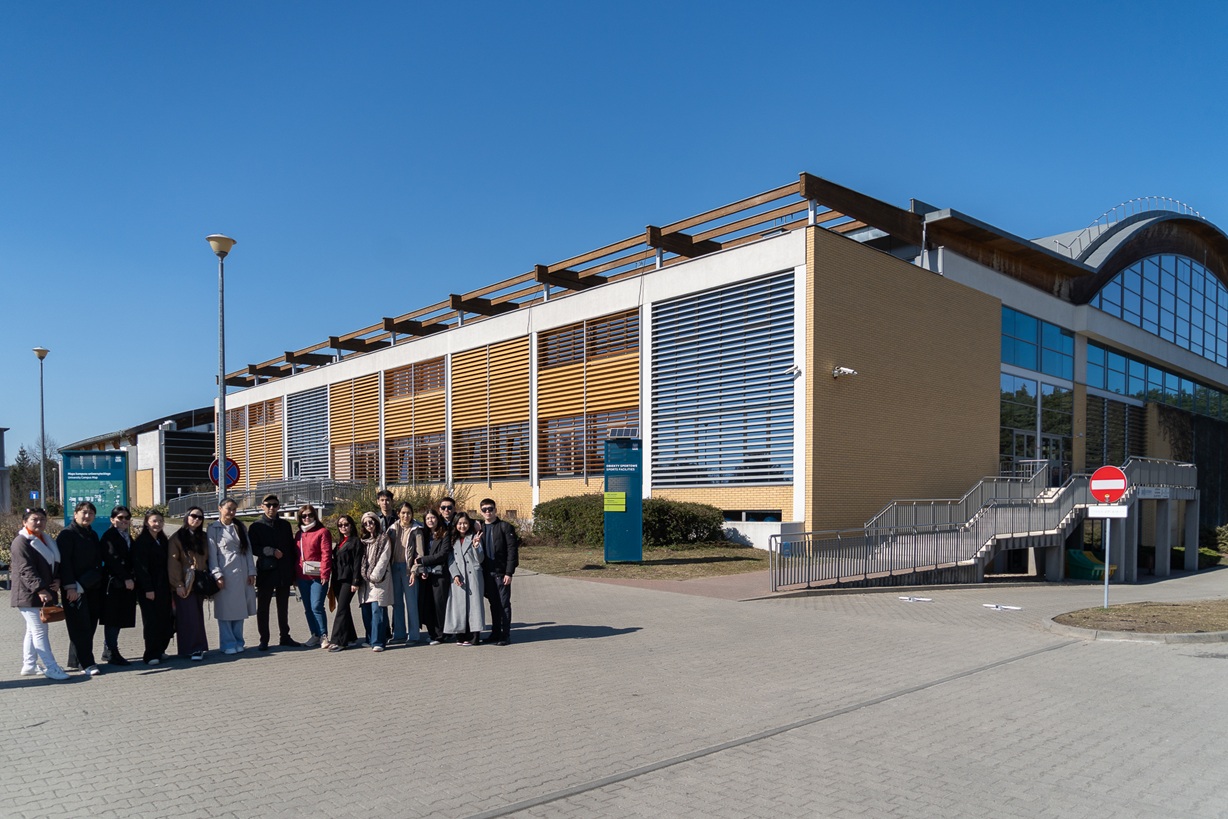 Interniship Participants in front of the AMU main sports hall