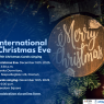 Poster for the International Christmas Eve event at AMU in Poznań, featuring a wooden ‘Merry Christmas’ ornament on a Christmas tree. Includes event details: Christmas Eve meeting on December 18, 2025, at 3:30 p.m. at Hanka Dormitory, and Christmas carols singing at 6:00 p.m. at Freedom Square, with registration available via an online form