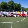 A group photo of participants of the 2019 Euroasmus and Friends Cup. The photo was taken on a football field.